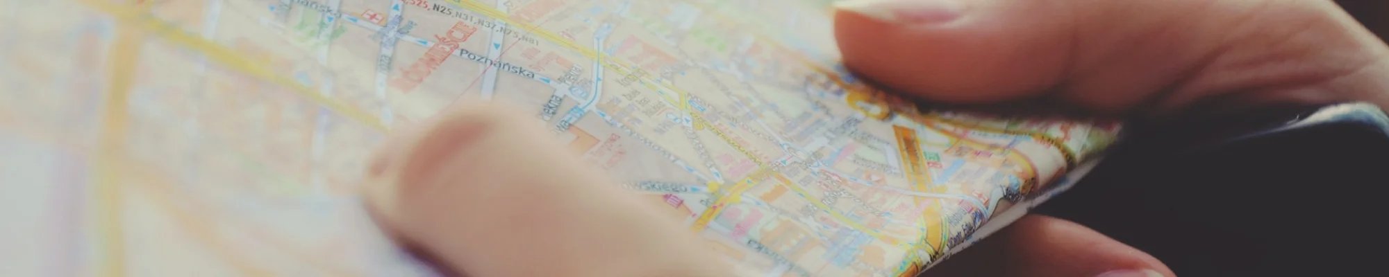 Person holding a paper map